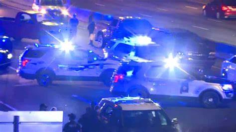 Four persons were hurt in a shootout on a Birmingham Alabama highway.